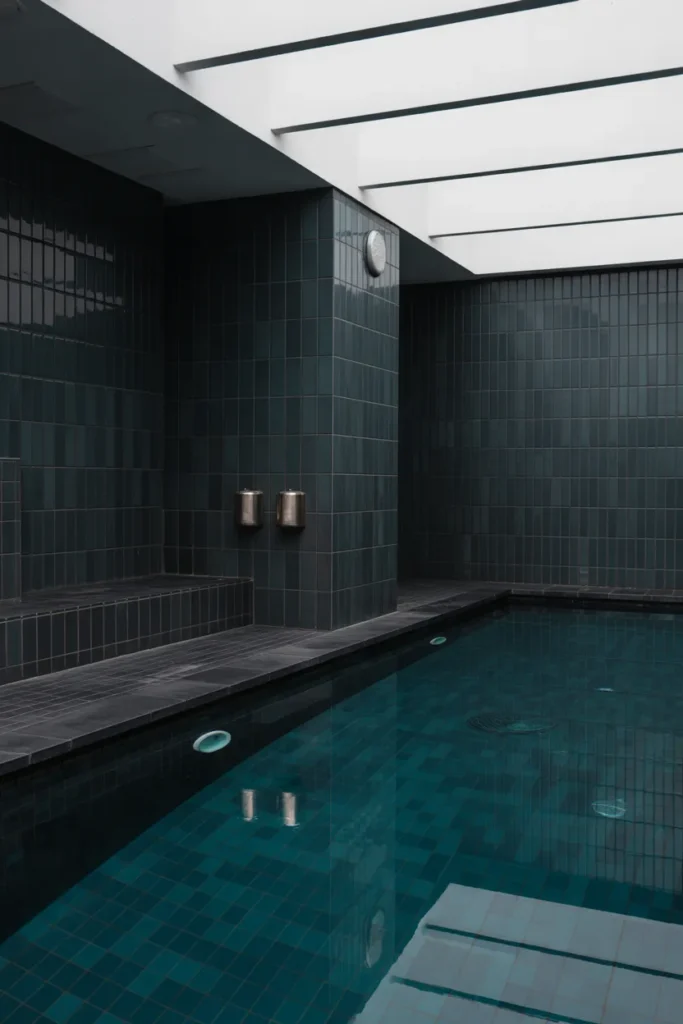 Chic Indoor Pool with Black Tile Finish